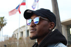 Man wearing Apollo wayfarer hemp sunglasses with blue mirrored lenses