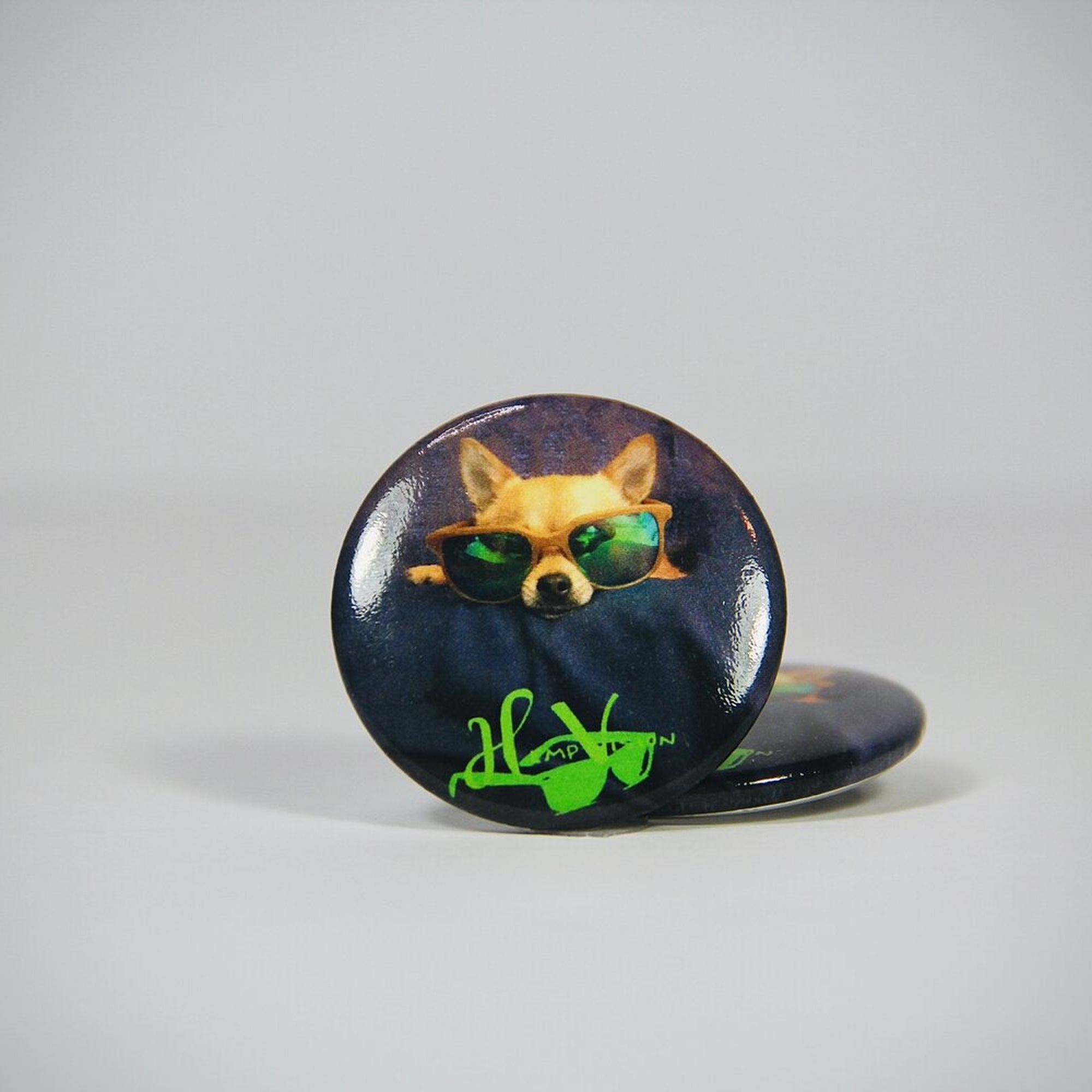 Hemp3D dog button pin badge — chihuahua in sunglasses on a navy background, two buttons shown
