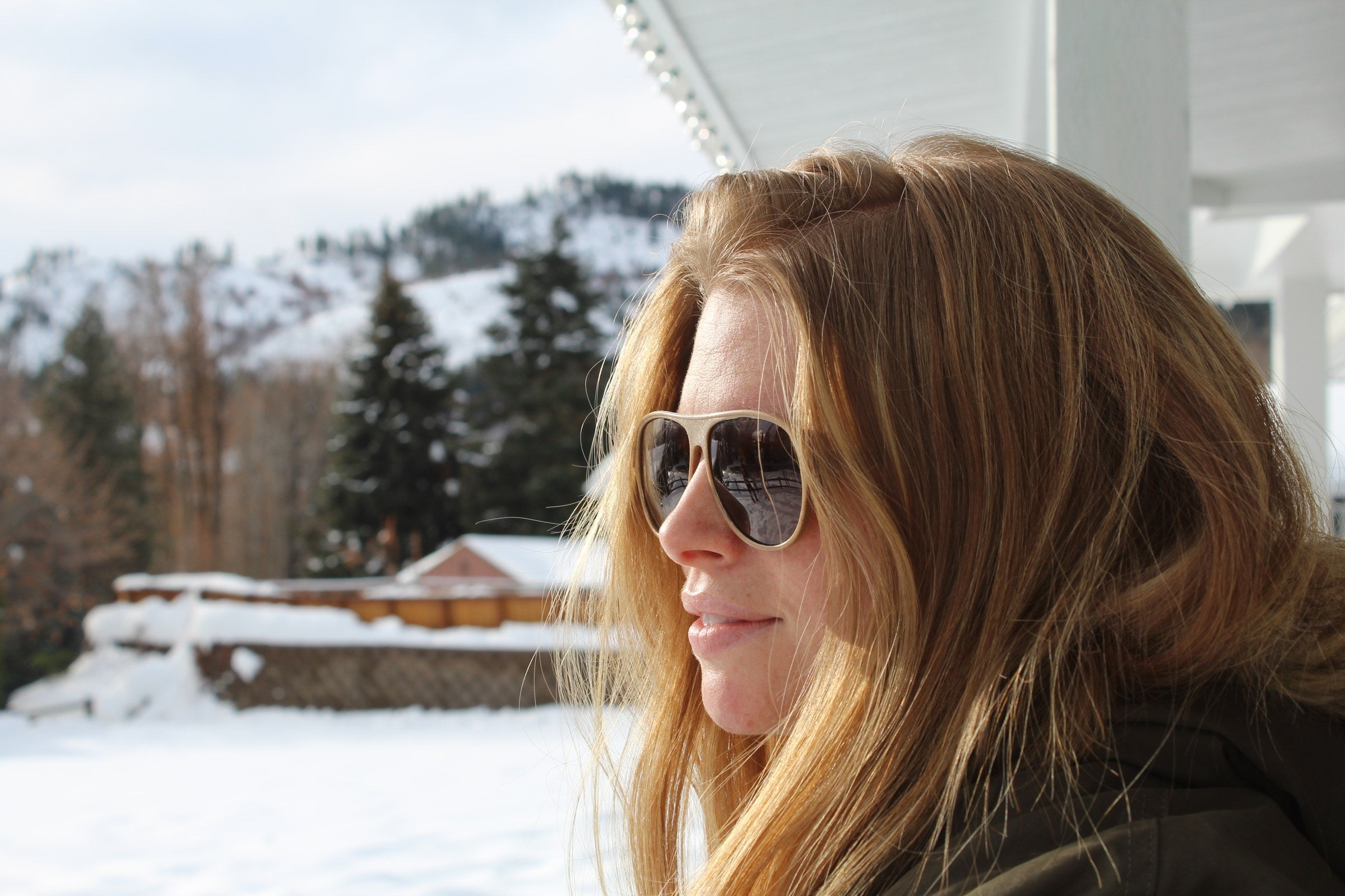 Woman wearing Hermes aviator hemp sunglasses with gradient lenses in the snow